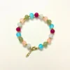 Chic Multi-Colored Bead Bracelet with Gold Star Charms