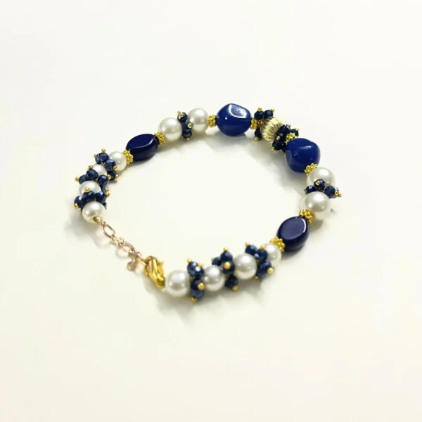 Dark Blue Onyx Bracelet with Pearl Embellishments and Gold-Tone Accents