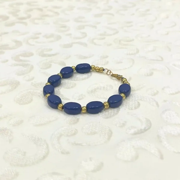 Elegant Blue Oval Bead Bracelet with Gold Accents